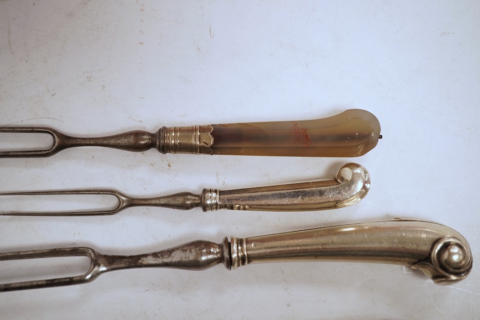 Five assorted George pistol handled steel pronged forks, four with white metal handles and one with agate handle, together with two similar mother of pearl handled steel pronged forks, largest 20.5cm and a small agate ha